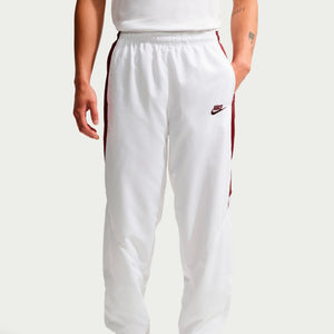 Nike Premier Repel Pants in white with a dark red stripe down each leg and a small logo on the left hip, perfect for your game-day look.