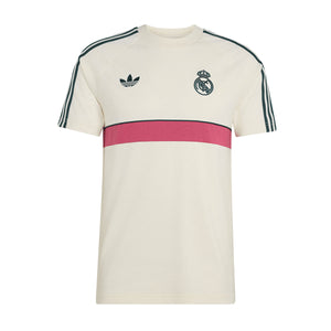Off-white adidas Real Madrid Originals T-Shirt with dark green shoulder stripes, a horizontal pink chest stripe, a trefoil logo on the right, and a soccer team crest on the left.