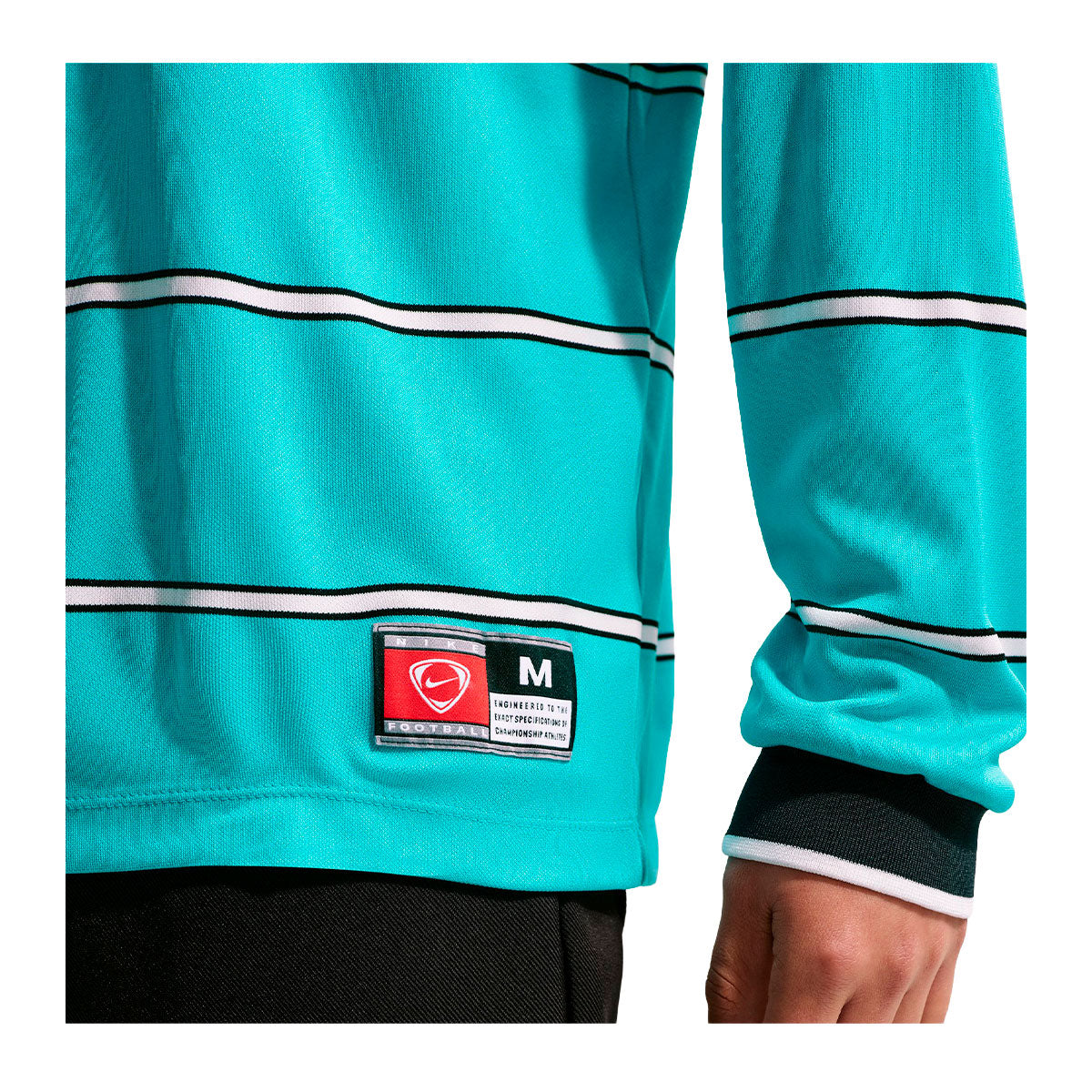 Nike Energy Long Sleeve T-Shirt in turquoise with black and white horizontal stripes, featuring a rectangular logo patch at the hip for an official soccer gear game-day look.