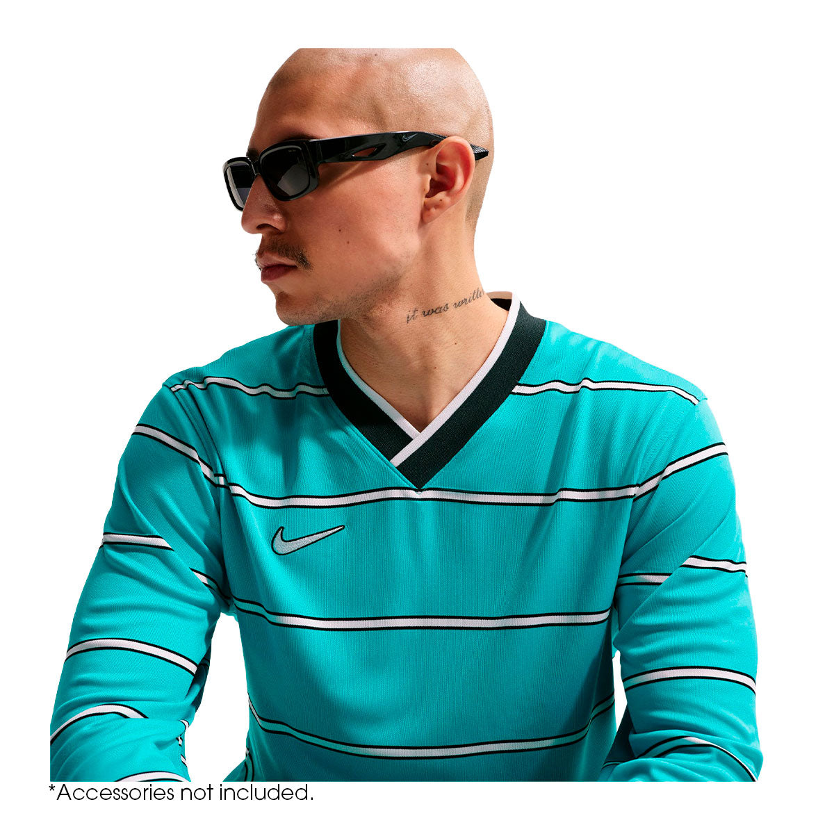A person wearing a teal Nike Energy Long Sleeve T-Shirt with a V-neck, horizontal black and white stripes, and a small logo on the chest, perfect for a game-day look.
