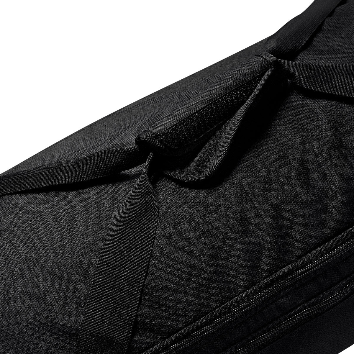 Close-up of a black Nike Academy Duffel Bag featuring a hook-and-loop fastener handle wrap on the carrying straps.