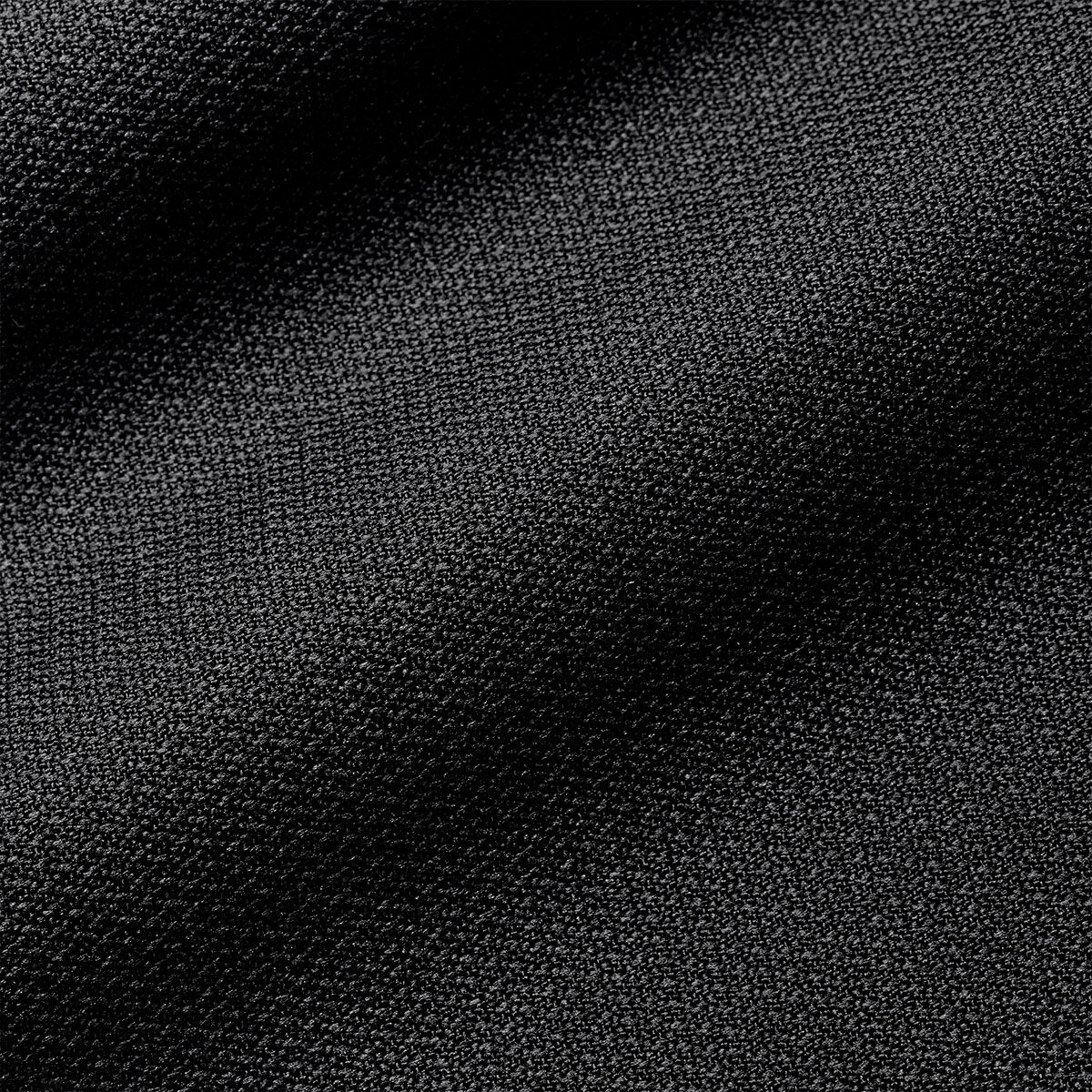 Close-up of the black fabric on a Nike Academy Duffel Bag, featuring a fine, textured weave characteristic of official soccer gear.