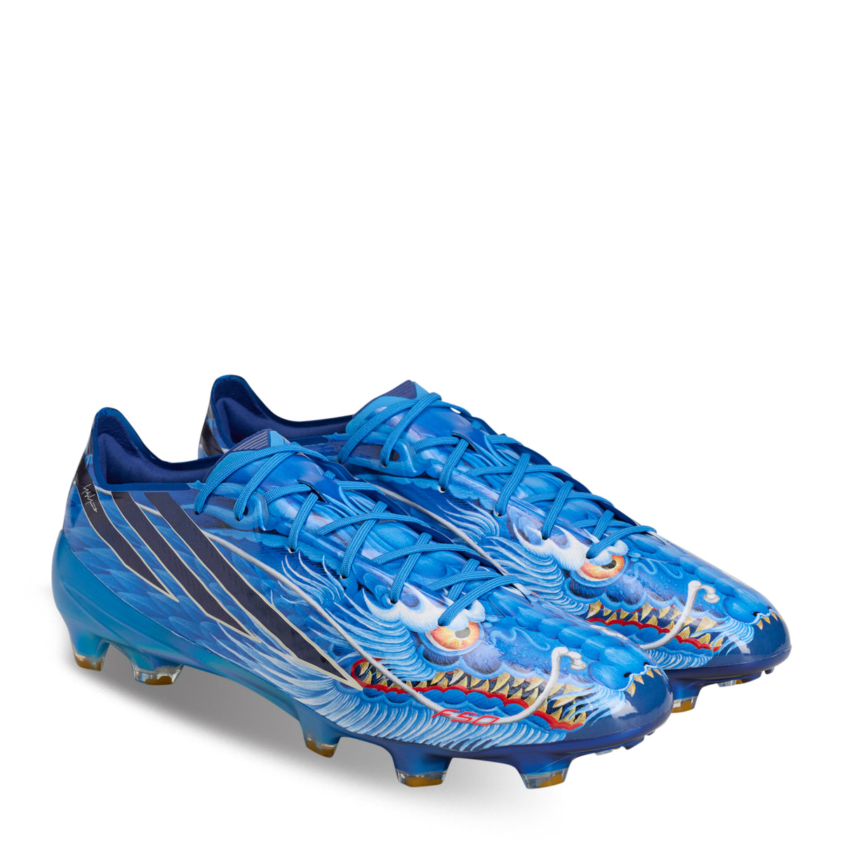 Blue adidas F50 Hyperfast Elite Y-3 FG kids soccer cleats featuring a prominent dragon graphic and the classic three-stripe design.